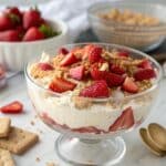 Creamy cottage cheese cheesecake dip topped with strawberries
