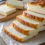 fluffy cottage cheese cloud bread slices on parchment paper
