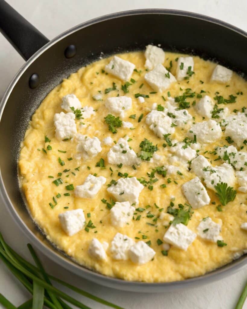 Scrambled eggs cooked with cottage cheese and herbs
